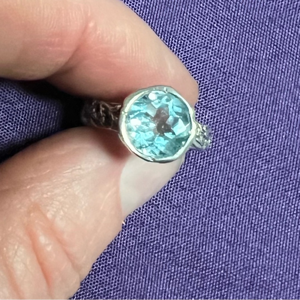 Sz5 Sterling silver 925 band with blue topaz solitaire.